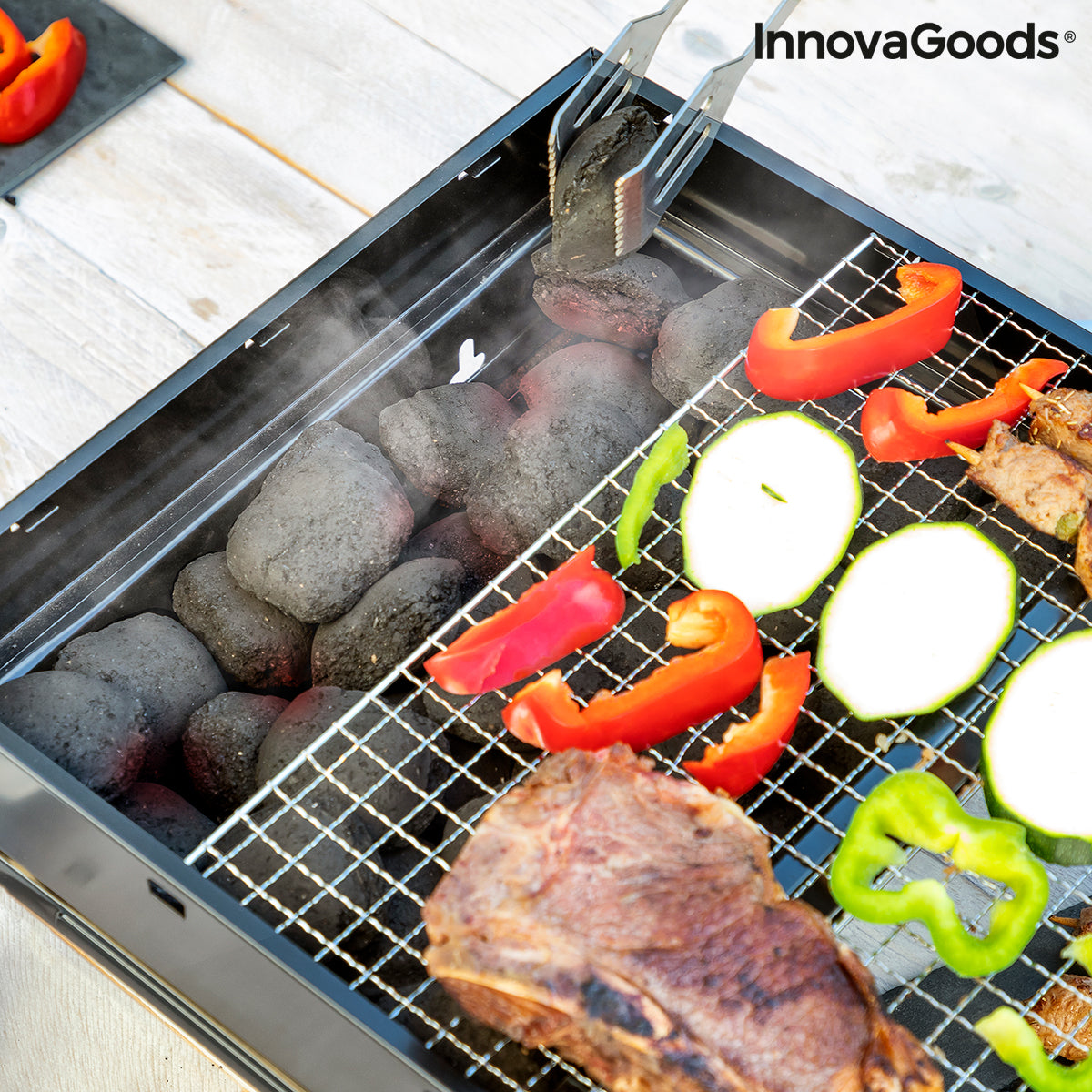 Opvouwbare draagbare barbecue voor gebruik met houtskool BearBQ InnovaGoods